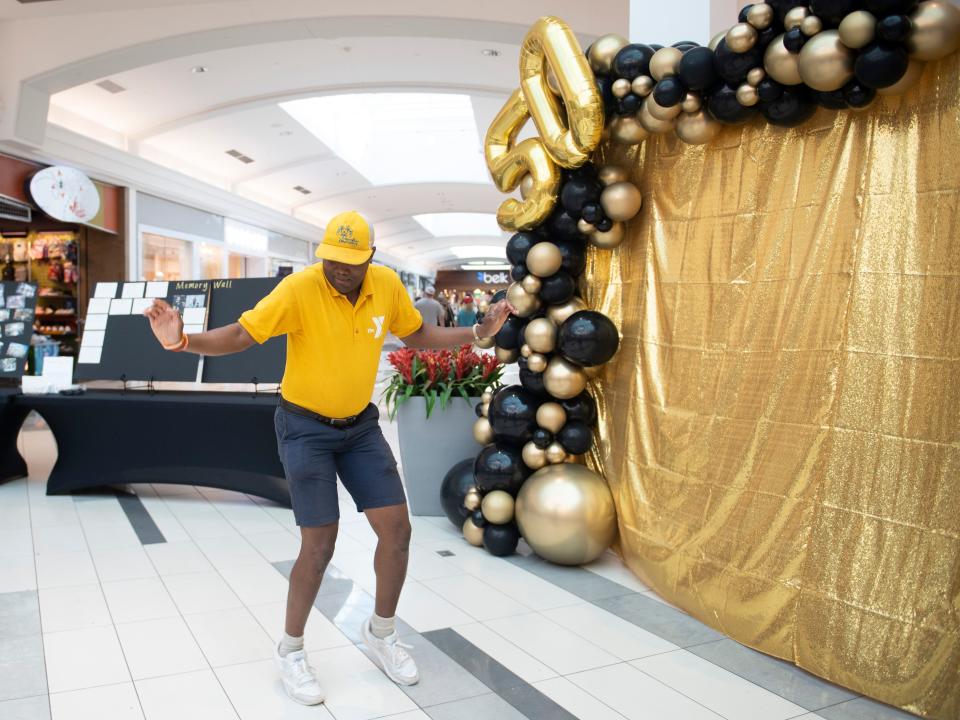 Brent Anderson dances during the 50th anniversary celebration of West Town Mall 50th on Tuesday, August 2, 2022. 