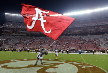 Sep 13, 2014; Tuscaloosa, AL, USA; Alabama Crimson Tide mascot Big Al waves the Alabama flag following their 52-12 victory against the Southern Miss Golden Eagles at Bryant-Denny Stadium. (John David Mercer-USA TODAY Sports)