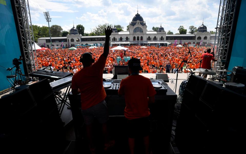 A DJ puts on a show for Netherlands fans in Budapest - REUTERS