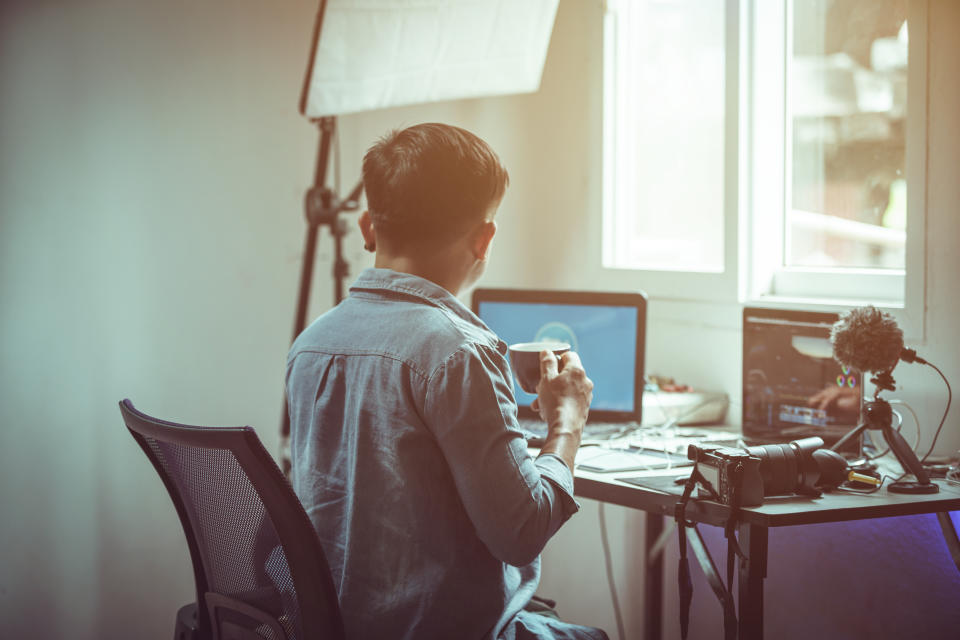 Young male content creator working from home The effects of the outbreak of the Corona virus or Covid-19