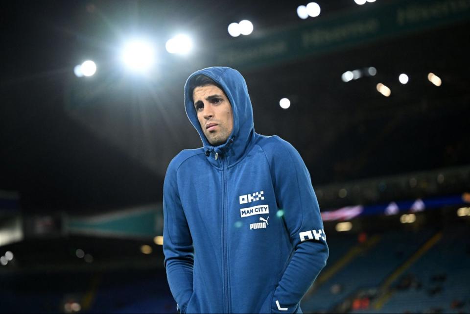 Frozen out? Cancelo has struggled for game time since returning from the World Cup (AFP via Getty Images)