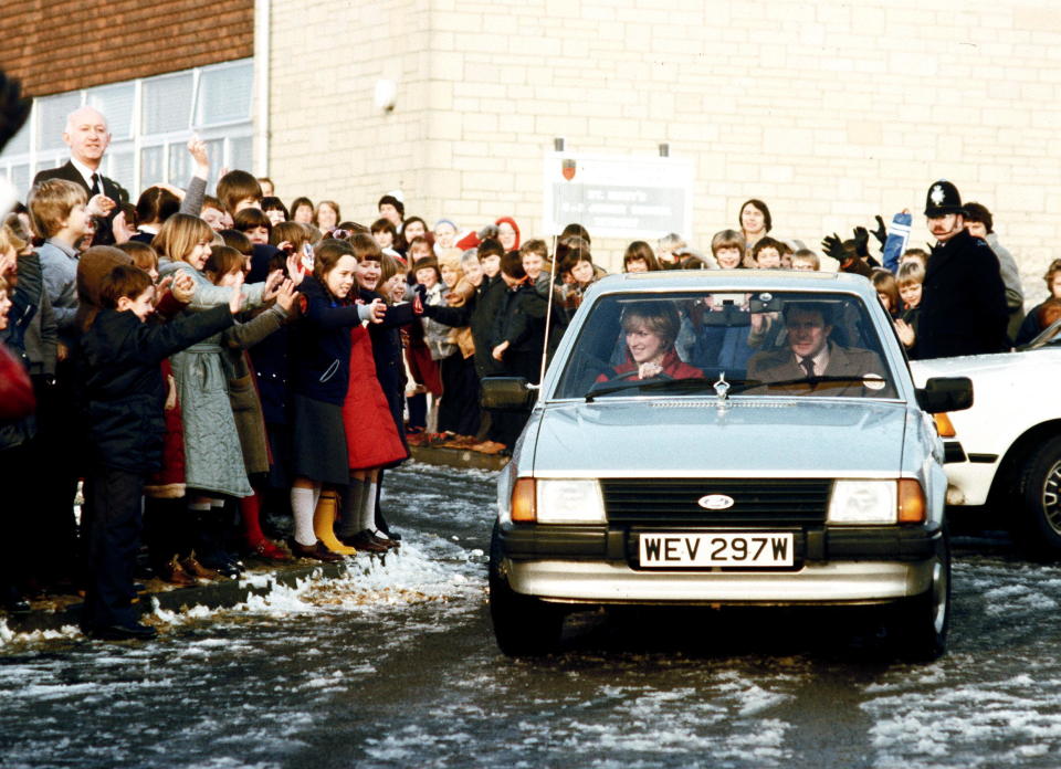 TETBURY, UNITED KINGDOM - DECEMBER 08:  Princess Diana Driving Her Ford Escort Car On Leaving St Mary's Primary School In Tetbury.  Bodyguard Graham Smith In The Passenger Seat  (Photo by Tim Graham Photo Library via Getty Images)