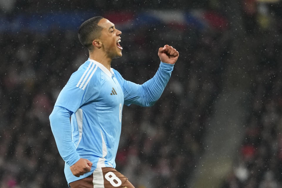 Belgium's Youri Tielemans celebrates after scoring his side's opening goal during an international friendly soccer match between England and Belgium at Wembley Stadium, in London, Tuesday, March 26, 2024. (AP Photo/Kirsty Wigglesworth)