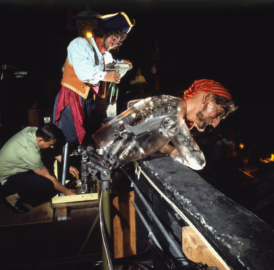 A man works on the animatronic figures featured in the "Pirates of the Caribbean" ride at Disneyland.