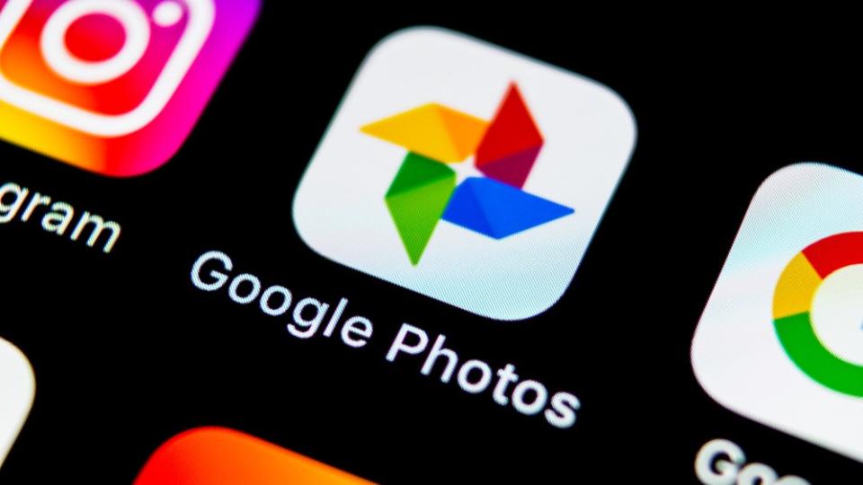 Angled shot of the Google Photos app logo on a screen