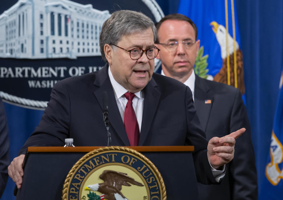 William Barr, U.S. attorney general, left, speaks as Rod Rosenstein, deputy attorney general, listens during a news conference. (Photo: Erik Lesser/Pool via Bloomberg/Getty Images)