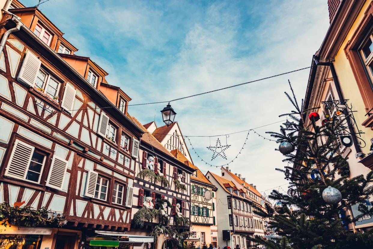 half timbered building with christmas decorations in obernai, france