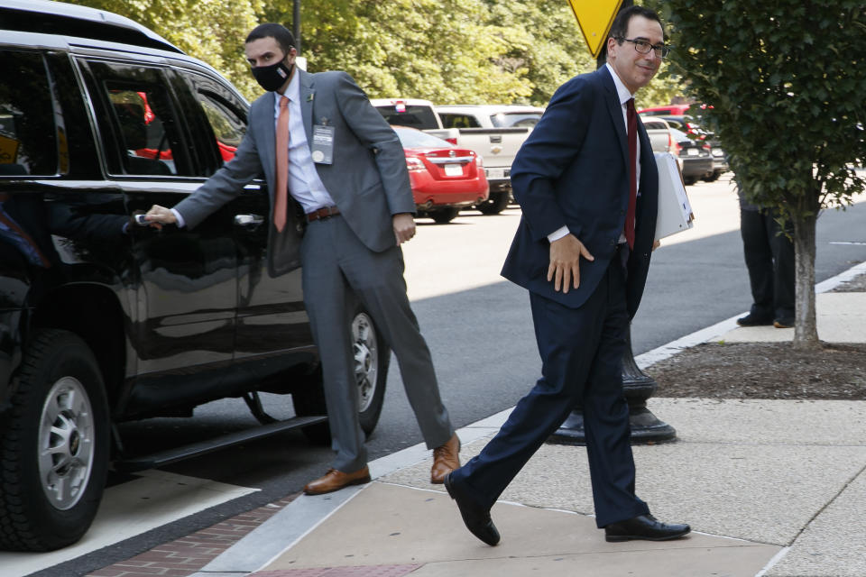 Treasury Secretary Steven Mnuchin arrives for continued negotiations ahead of a meeting, Wednesday, Aug. 5, 2020, on Capitol Hill in Washington. (AP Photo/Jacquelyn Martin)