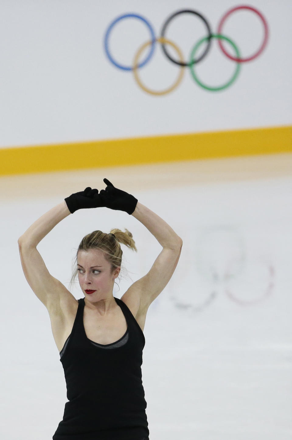 Ashley Wagner of the United States skates during a practice session at the figure stating practice rink at the 2014 Winter Olympics, Tuesday, Feb. 18, 2014, in Sochi, Russia. (AP Photo/Bernat Armangue)