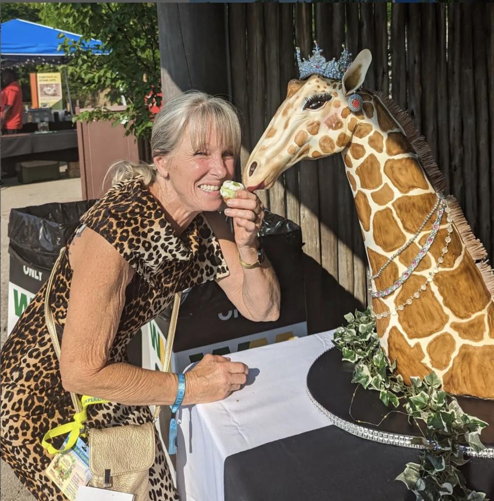 Karen E. Laine wears animal print dress 