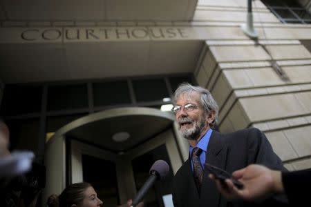 Douglas Hughes talks to reporters outside of a courthouse in Washington June 22, 2015. REUTERS/Carlos Barria