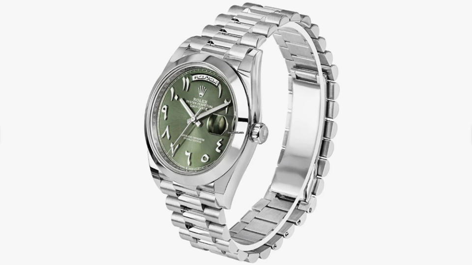 Platinum Rolex Day-Date 40 with an olive-green dial with Eastern Arabic numerals