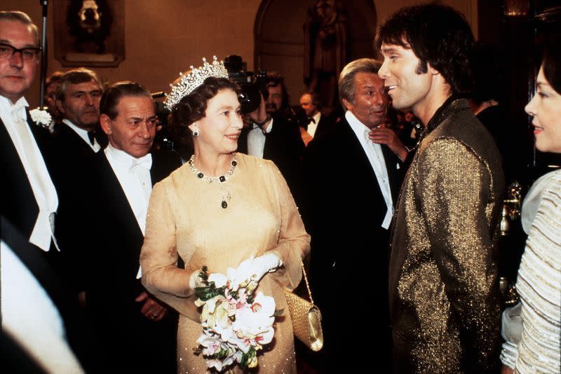 <p>Queen Elizabeth looked stunned meeting singer Cliff Richard and after seeing his gilded blazer. It’s bold, sure, but it somehow works.</p>