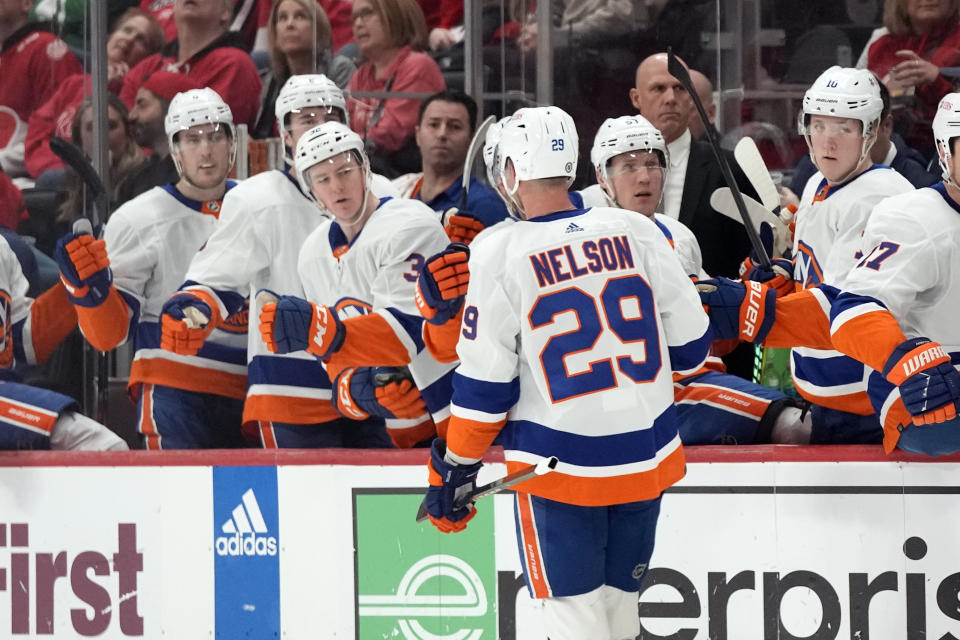 New York Islanders center Brock Nelson (29) greets teammates after scoring during the first period of an NHL hockey game against the Detroit Red Wings, Thursday, Feb. 29, 2024, in Detroit. (AP Photo/Carlos Osorio)