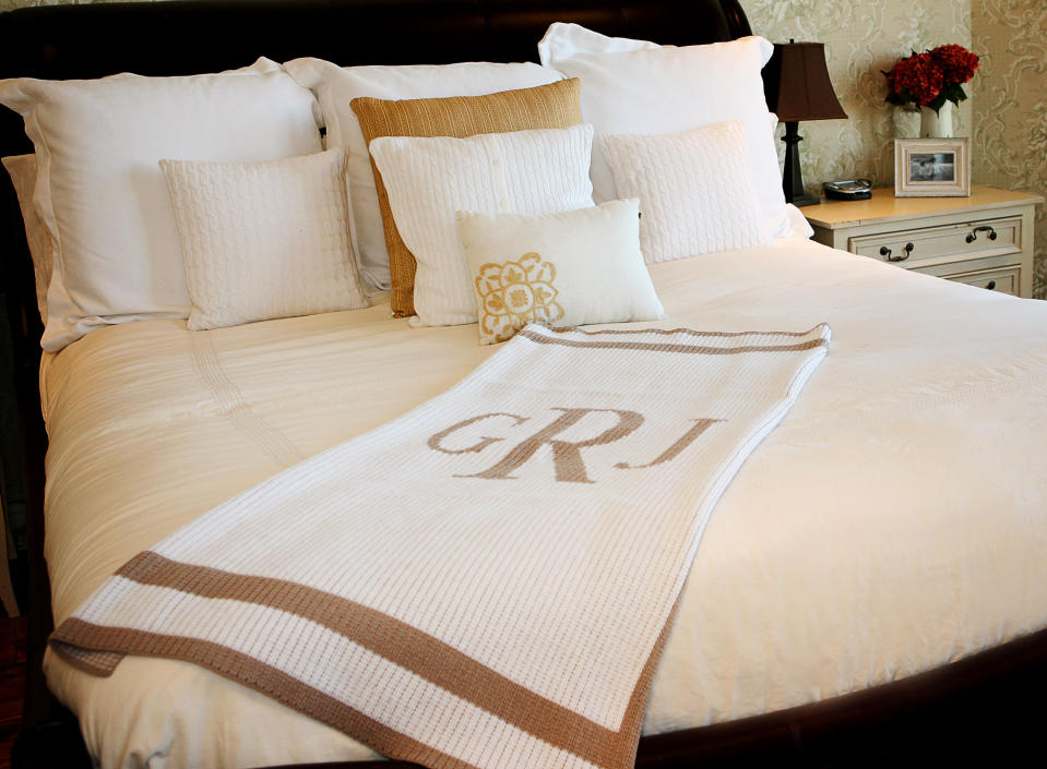 This photo provided by Girlytwirly.com shows a soft blanket embroidered with Mom’s initial which is a thoughtful gift. This one comes in either acrylic or cashmere, and the trim and initial can be had in a wide range of color options. (AP Photo/Girlytwirly.com)