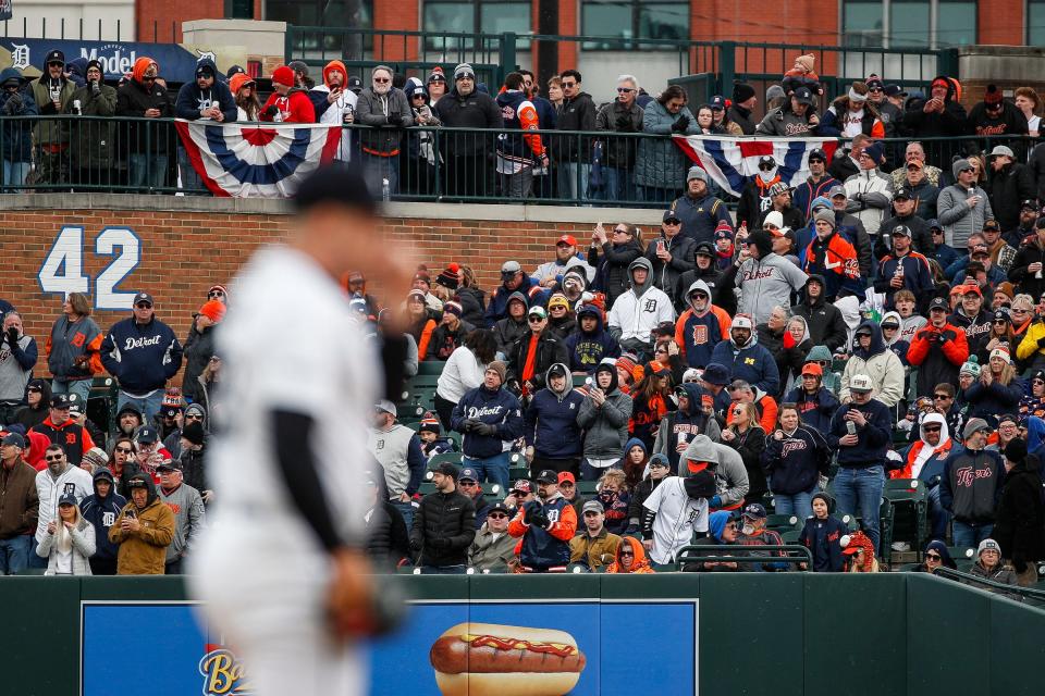 Detroit Tigers fans watch Detroit Tigers pitcher Tarik Skubal (29) pitching against Oakland Athletics during the first inning of the home opening day at Comerica Park in Detroit on Friday, April 5, 2024.