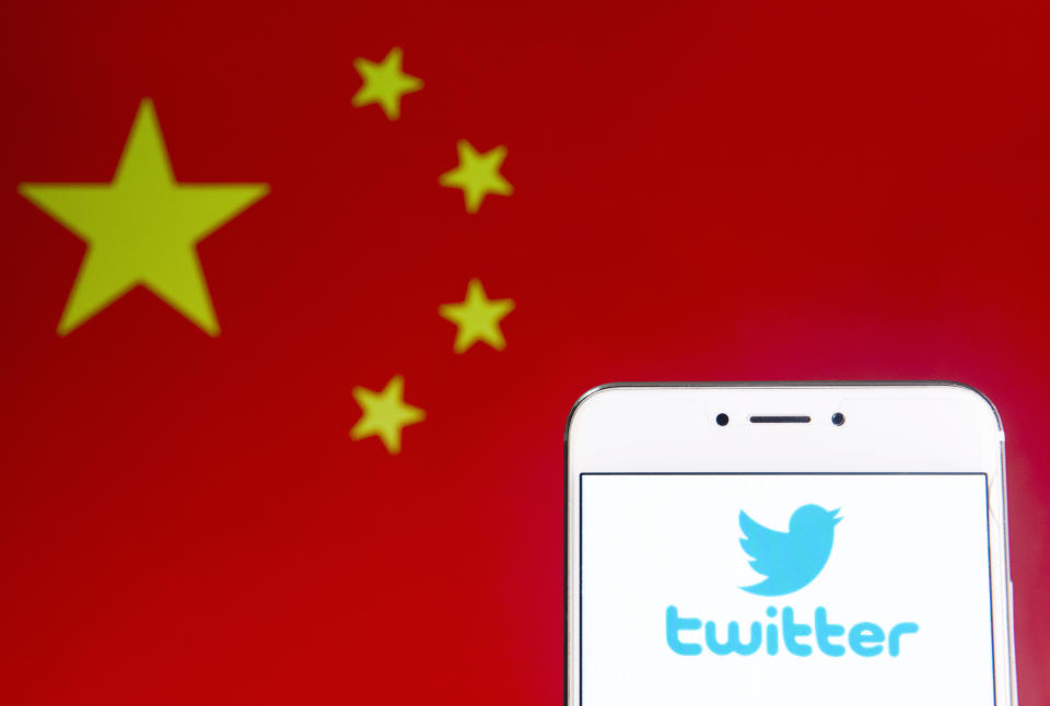 HONG KONG - 2019/04/06: In this photo illustration a American online news and social networking service Twitter logo is seen on an Android mobile device with People's Republic of China flag in the background. (Photo Illustration by Budrul Chukrut/SOPA Images/LightRocket via Getty Images)