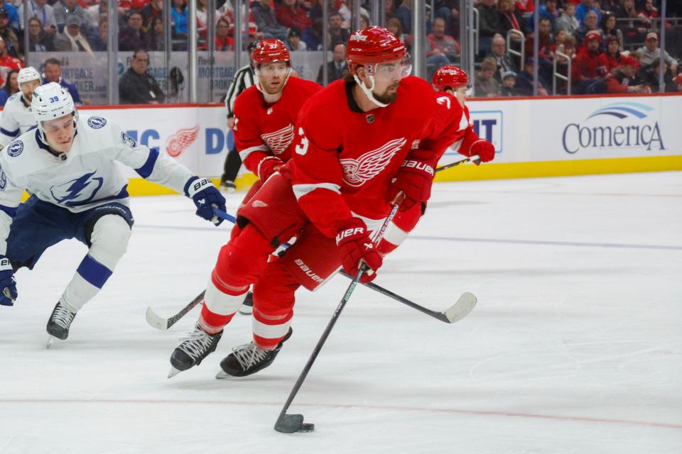 Detroit Red Wings defenseman Justin Holl (3) handles the puck during the first period at Little Caesars Arena in Detroit on Sunday, Jan. 21, 2024.
