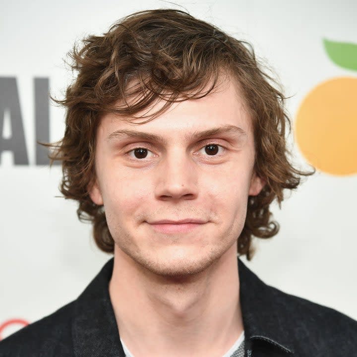 Evan Peters poses on the red carpet