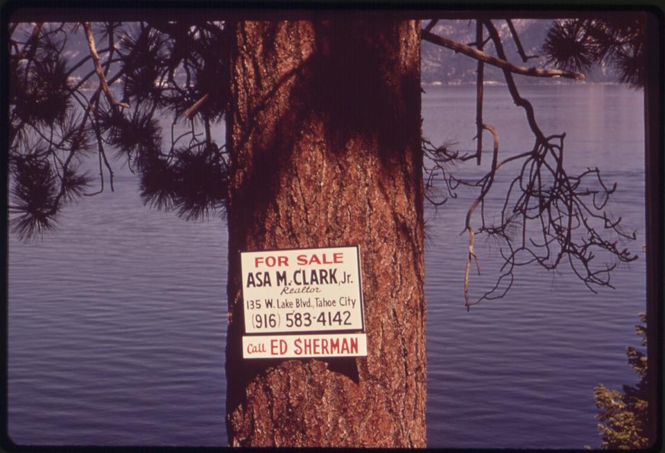 A for sale sign is seen at Lake Tahoe, Calif.,in May, 1972. The 1960 Winter Olympics near Tahoe City, the first ever televised, introduced the world to the lake surrounded by snow-covered peaks. From 1960-80, Tahoe's population grew from 10,000 to 50,000 — 90,000 in the summer, the U.S. Geological Survey said. Peak days now approach 300,000.