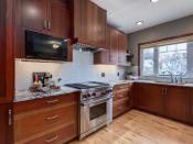 <p><span>230 24 Avenue Northeast, Calgary, Alta.</span><br> The kitchen has granite countertops, under-cabinet lights and a Fisher Paykal dishwasher.<br> (Photo: Zoocasa) </p>