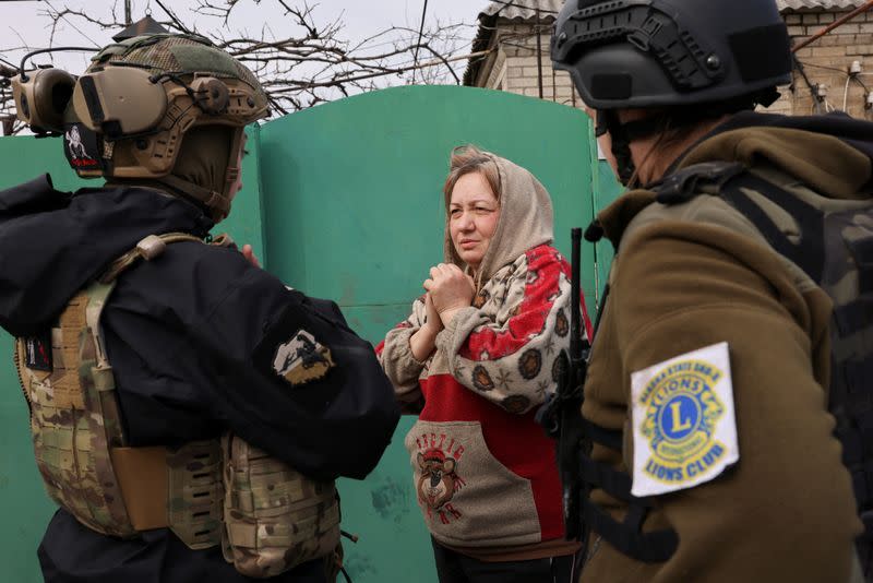 Volunteers try to persuade remaining civilians to evacuate bombed-out town Chasiv Yar near eastern frontline