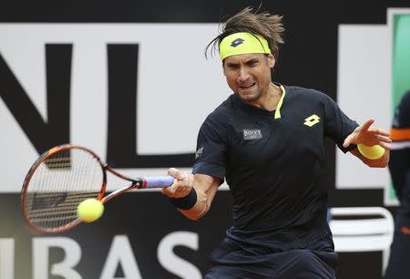 David Ferrer of Spain returns the ball to Novak Djokovic of Serbia during their semi-final match at the Rome Open tennis tournament in Rome, Italy, May 16, 2015. REUTERS/Stefano Rellandini