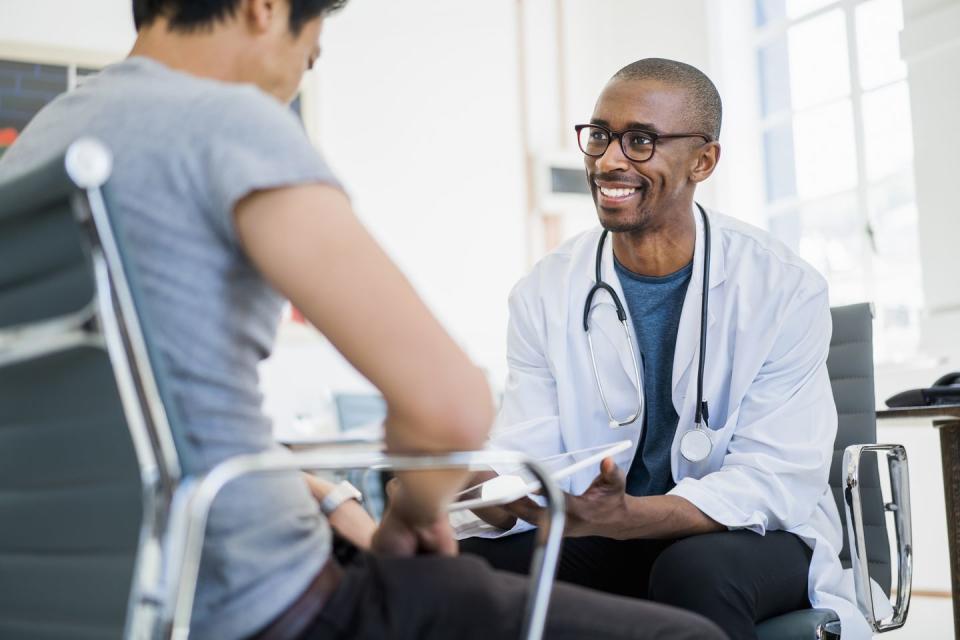 doctor showing results to patient in hospital