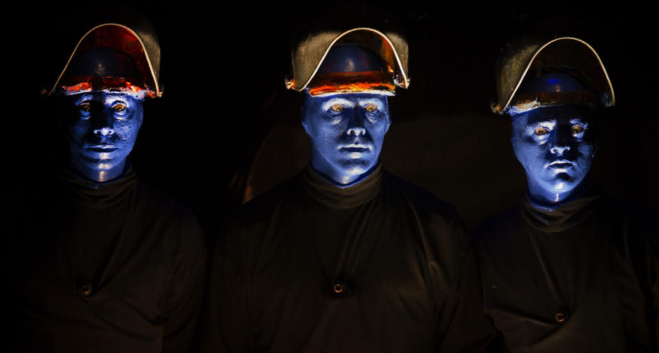 In this July 10, 2013 photograph, members of the Blue Man Group perform at the Briar Street Theatre in Chicago. Blue Man Group, which started with three friends in New York more than two decades ago, has grown from an off-Broadway show to also have productions in Boston, Chicago, Las Vegas and Orlando, Fla. A tour will soon take the blue men to stops in cities like Atlantic City, N.J.; Durham, N.C.; Lincoln, Neb.; Corpus Christi, Texas; Portland, Maine; and Kennewick, Wash. (AP Photo/Scott Eisen)