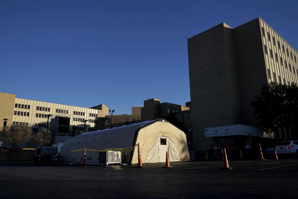 A portable, overflow, intensive care unit, that is currently not being used, is seen located behind Hendrick Medical Center on Wednesday, Dec. 16, 2020, in Abilene, Texas. (AP Photo/Tony Gutierrez)