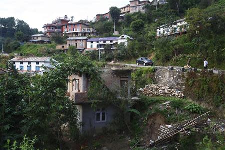 The half-finished house of Raju Prasad Lamichhane, which he had started to build with brother Dilli and now-deceased father Shiva, while they were working in Qatar, is pictured in Telkot village, near Kathmandu October 1, 2013. REUTERS/Navesh Chitrakar