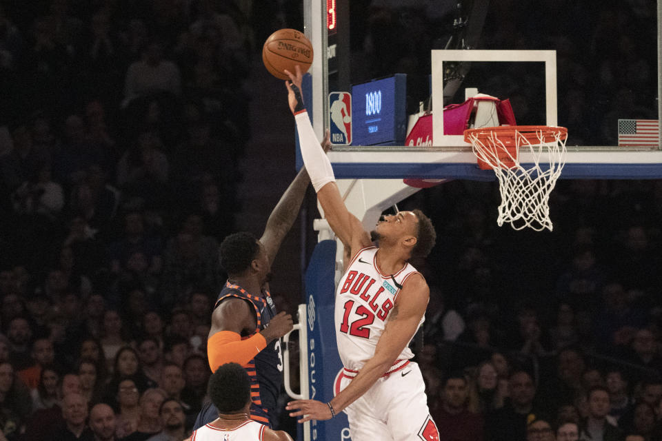 Chicago Bulls forward Daniel Gafford (12) blocks a shot by New York Knicks forward Julius Randle (30) during the first half of an NBA basketball game, Saturday, Feb. 29, 2020 in New York. (AP Photo/Mark Lennihan)