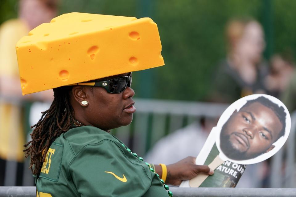 Green Bay Packers fan Tameka Tmith watches outside the NFL football team's practice field Wednesday, July 27, 2022, in Green Bay, Wis. (AP Photo/Morry Gash)