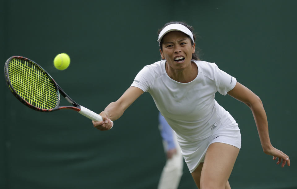 Taiwan's Su-Wei Hsieh returns to Latvia's Jelena Ostapenko in a Women's singles match during day one of the Wimbledon Tennis Championships in London, Monday, July 1, 2019. (AP Photo/Ben Curtis)