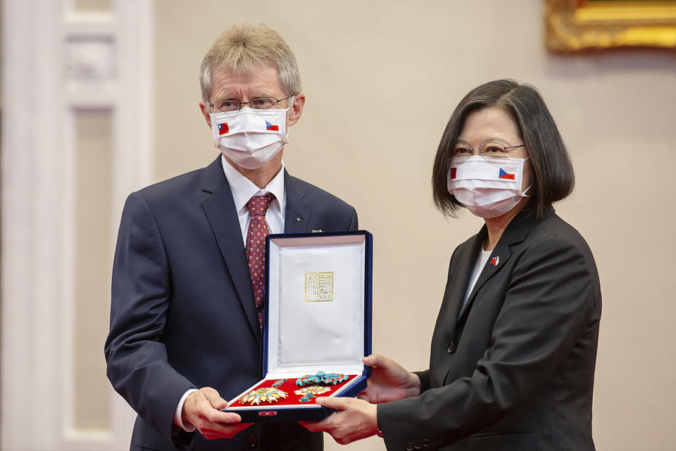 In this photo released by the Taiwan Presidential Office, the Czech Senate President Milos Vystrcil is presented a medal by Taiwanese President Tsai Ing-wen during a meeting in Taipei, Taiwan on Thursday, Sept. 3, 2020. The Czech Senate president met with Taiwanese leader Tsai Ing-wen and other top government officials Thursday during a rare trip by a foreign dignitary to the self-ruled democratic island that rival China called an "open provocation." (Taiwan Presidential Office via AP)