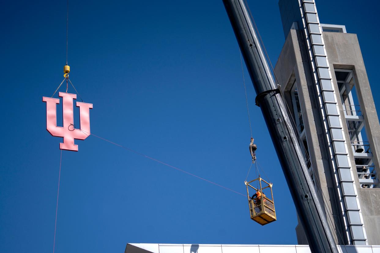 A sign of the Indiana University trident symbol is raised Monday, March 11, 2024 atop the IUPUI Campus Center. On July 1, 2024, Indiana University and Purdue University will split on the campus. This building will be the Indiana University Indianapolis Campus Center.