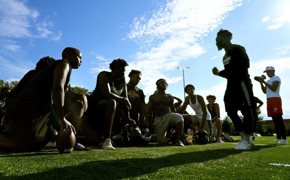 Central HS Knights coach, Mike Washington giving his team a supportive last word before ending their first day of practice at Bucklin Park in Providence Monday evening.