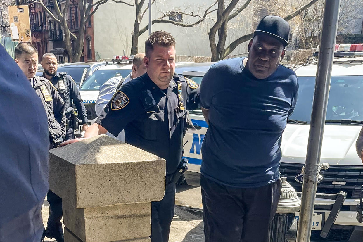 Police escort Frank R James who is wanted in connection with Tuesday's mass subway shooting in Brooklyn, N.Y. (Obtained by NBC News)