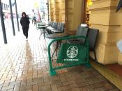 FILE PHOTO: A pedestrian walks past a Starbucks cafe in central Wellington