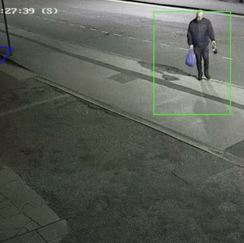 CCTV footage shows Ian Bennett walking with a plastic bag in his right hand.