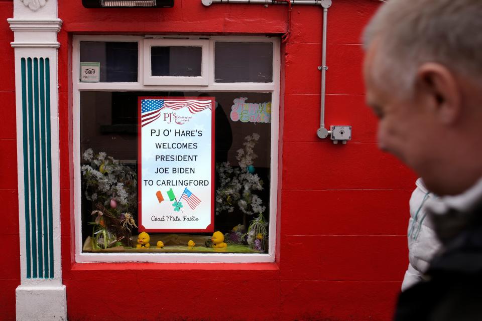 Local pub hangs a sign welcoming the president (AP)