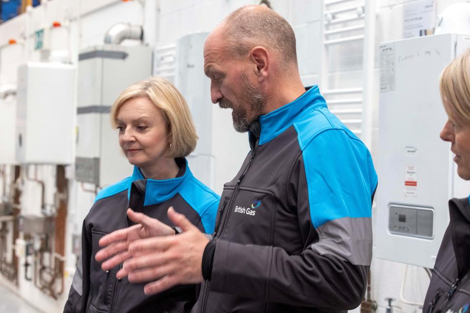 Britain's Prime Minister Liz Truss (L) listens as Centrica CEO Chris O'Shea (C) speaks during her visit to Centrica's British Gas academy in Dartford, east of London on September 30, 2022. (Photo by Ian Vogler / POOL / AFP) (Photo by IAN VOGLER/POOL/AFP via Getty Images)