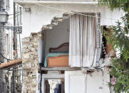 <p>Damged houses are seen on August 24, 2016 in Arquata del Tronto, Italy. Central Italy was struck by a powerful 6.2-magnitude earthquake in the early hours which has killed at least three people and devastated dozens of mountain villages. (Giuseppe Bellini/Getty Images) </p>