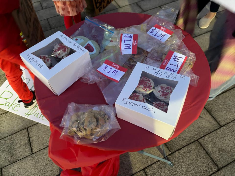 A group of parents and friends held a tongue-in-cheek bake sale to raise millions for the new Rogers High School building.