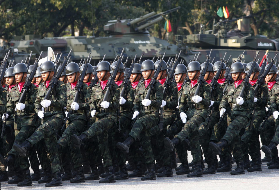 Thai soldiers parade during the Royal Thai Armed Forces Day ceremony at a military base in Bangkok, Thailand, Friday, Jan. 18, 2019. (AP Photo/Sakchai Lalit)