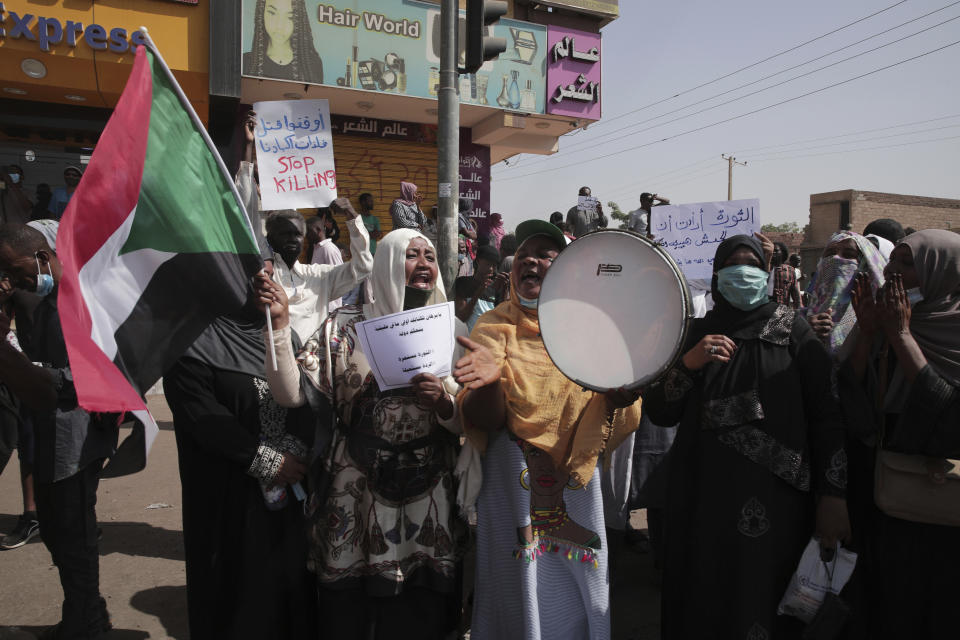 People gather during a protest in Khartoum, Sudan, Thursday, Jan. 13, 2022. Thousands of people took to the streets on Thursday against a coup that has plunged the country into grinding deadlock. (AP Photo/Marwan Ali)