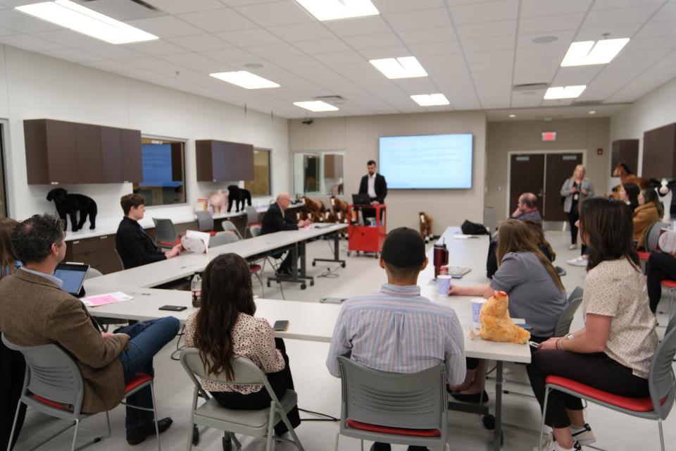 Attendees listen to a lecture Friday at the inaugural Amarillo Research Symposium at the Texas Tech School of Veterinary Medicine in Amarillo.