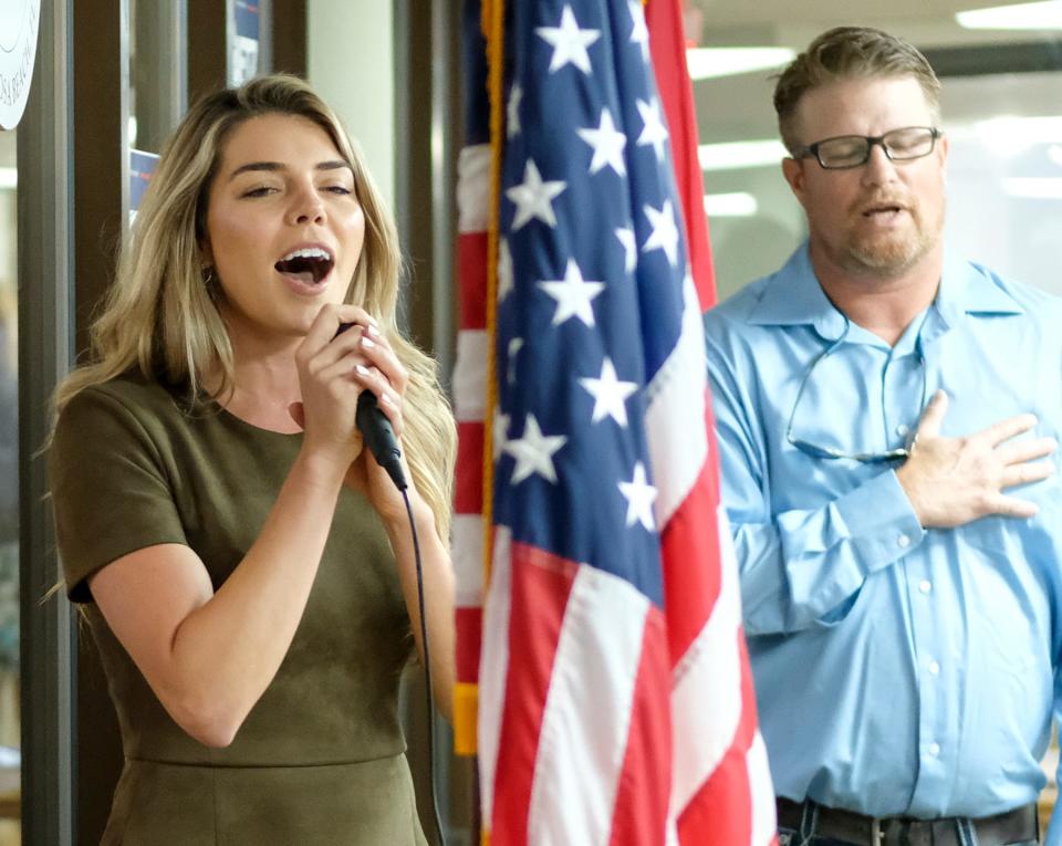 Ginger Gaetz, wife of U.S. Rep. Matt Gaetz sings the national anthem Tuesday during a meeting with the South Walton Republican Club in Miramar Beach.