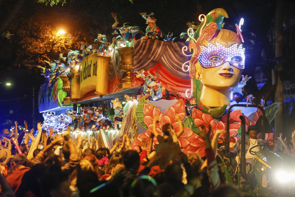 The Mystic Krewe of Nyx parade makes its way through the streets during Mardi Gras celebrations in New Orleans, Wednesday, Feb. 19, 2020. (AP Photo/Brett Duke)