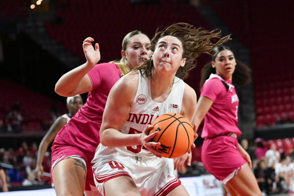 Jan 31, 2024; College Park, Maryland, USA; Indiana Hoosiers forward Mackenzie Holmes (54) look to shoot as Maryland Terrapins forward Allie Kubek (14) defends during the fist half at Xfinity Center. Mandatory Credit: Tommy Gilligan-USA TODAY Sports